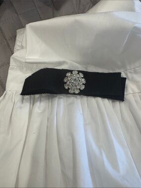 Weill Paris  Puff sleeve cotton blouse w black satin bows on sleeves.